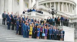  ?? PATRICK SEMANSKY/AP ?? Newly elected members of Congress pose for a class photo on the East Front of the Capitol in Washington, on Nov. 15. U.S. Rep.-elect Jared Moskowitz, D-Parkland, is second from left in front row (wearing a purple tie).