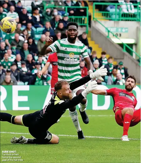  ??  ?? SURE SHOT: Turnbull drives home the second goal of his hat-trick