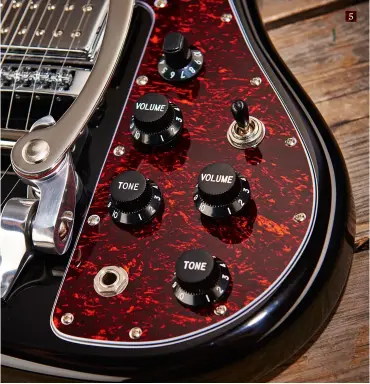  ??  ?? 5. The dual volume and tone layout, with threeway toggle switch, is hardly unusual, although adding a master volume on a solidbody like this is. The coil-splits are a great addition and they voice the neck-facing single coils of each humbucker 5