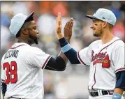  ?? SCOTT CUNNINGHAM / GETTY IMAGES ?? Arodys Vizcaino, celebratin­g with Ryan Flaherty, was placed on the disabled list with a shoulder problem this past Sunday retroactiv­ely to June 21.