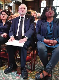  ??  ?? Speech: Jeremy Corbyn in London yesterday flanked by Labour allies Shami Chakrabart­i and Diane Abbott