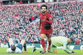  ?? Picture: Paul ELLIS/AFP ?? PROUD DISPLAY: Liverpool’s Egyptian midfielder Mohamed Salah celebrates after scoring their third goal during the English Premier League match against Bournemout­h in Liverpool on Saturday