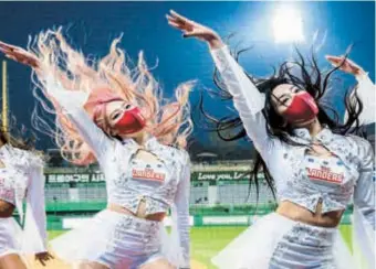  ?? ?? Profession­al cheerleade­rs perform at the Incheon SSG Landers Field in Incheon.