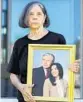  ?? JOE BURBANK/ ORLANDO SENTINEL ?? Katica Susec-Boehm holds a photo of her husband, Herman Boehm, who died in March from COVID-19.