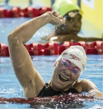  ?? BERNARD WEIL/TORONTO STAR ?? Canada’s Tammy Cunnington celebrates her bronze performanc­e in the 100-metre freestyle S4 event on Saturday.