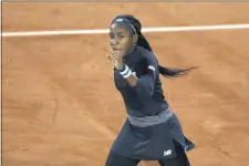  ?? ALESSANDRA TARANTINO — THE ASSOCIATED PRESS ?? Cori Gauff of the U.S. clenches her fist after scoring a point against Britain’s Johanna Konta in the first round match of the French Open tennis tournament at the Roland Garros stadium in Paris, France, Sunday, Sept. 27, 2020.