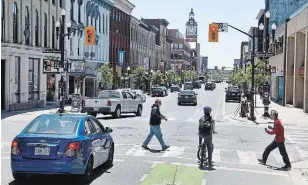  ?? CLIFFORD SKARSTEDT EXAMINER ?? The City of Peterborou­gh reopens George Street after complaints from businesses and the DBIA on Saturday. The closure began Friday and was intended to continue until Sunday.