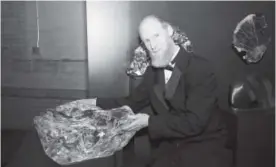  ??  ?? The museum’s curator of geology, James Hagadorn, with the quartz that he describes as “Our Blarney Stone.”