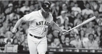  ?? Karen Warren / Staff photograph­er ?? The Astros’ Evan Gattis reacts after flying out during the eighth inning Saturday. Houston has dropped three in a row to Seattle.