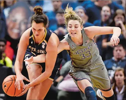  ?? SEAN D. ELLIOT/THE DAY ?? UConn’s Katie Lou Samuelson pokes the ball away from Notre Dame’s Kathryn Westbeld (33) in the second half of Sunday’s game at the XL Center in Hartford. UConn rallied for an 80-71 win. Please go to theday.com to view a photo gallery.