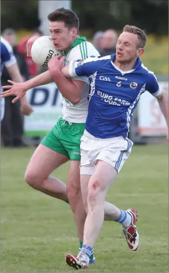  ?? Picture: Paul Connor ?? Ciaran Lenihan of Skyrne gets a successful tackle in on St Pat’s Shane Dowling during Friday’s SFC match in Duleek.