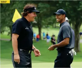  ?? LEHTIKUVA/GETTY IMAGES/AFP/SAM GREENWOOD ?? Phil Mickelson och Tiger Woods.