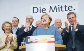  ?? — Reuters ?? Christian Democratic Union party leader and Chancellor Angela Merkel reacts on first exit polls in the German general election in Berlin on Sunday.