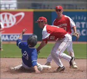  ?? MEDIANEWS GROUP FILE PHOTO ?? Souderton’s Hogan Despain tags Central Bucks South’s Jake McKeown out in the 5th inning of the PIAA 5A State Championsh­ip at Medlar Field at Penn State University.