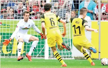  ?? - AFP photo ?? Marco Reus inspired Borussia Dortmund to a crucial win over Freiburg in the Bundesliga on Sunday.