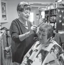  ?? SHARON MONTGOMERY-DUPE • CAPE BRETON POST ?? Joan Mackinnon, owner of the Isle Royal Beauty Salon in Sydney, cuts the hair of Kathy Hardy on Friday. Hardy has been a customer for 45 years. After 53 years in the business, Mackinnon has sold the salon and has retired.