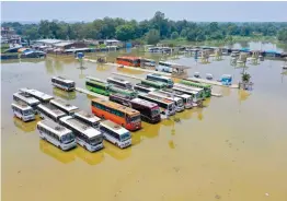  ?? — PTI ?? A bus depot is submerged due to incessant rain in Darbhanga district of Bihar on Sunday.