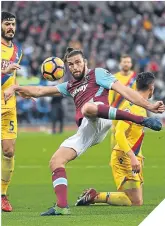  ??  ?? Andy Carroll sends in a volley.