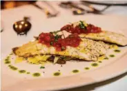  ?? ?? A popular main course at La Ciccia is the pisci de mari arrustiu, seared fish with capers and almonds. .