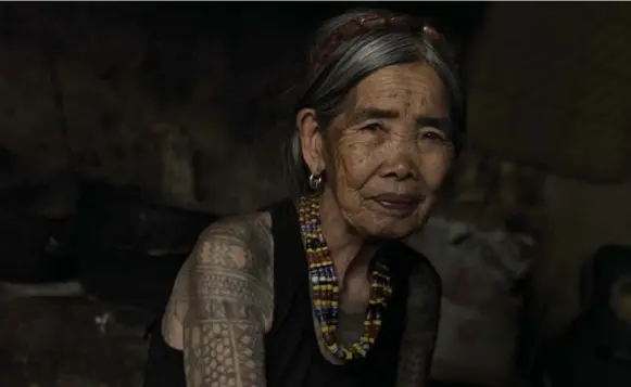  ?? JES AZNAR PHOTOS/THE NEW YORK TIMES ?? Maria Fang-od Oggay belongs to the last generation of her ethnic group bearing a full set of traditiona­l tattoos and is one of the few who remember how they are done.