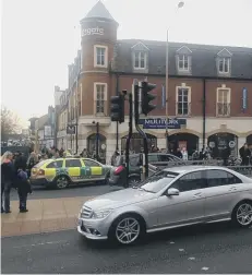  ??  ?? Paramedics treat an injured pedestrian.