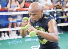  ?? JOHN LOCHER/ASSOCIATED PRESS ?? Floyd Mayweather Jr. has worn 8-ounce gloves for most of his career, but Nevada generally requires 10-ounce gloves for bouts fought at 147 pounds or higher. The Mayweather-McGregor fight is at 154 pounds.