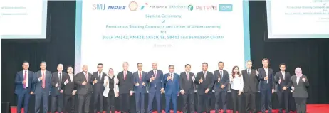  ?? ?? Petros vice president for upstream Jeremy Wong (fourth left), is seen on-stage with other signatorie­s of the agreements, during the event in Kuala Lumpur.