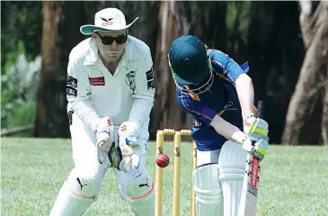  ??  ?? Ellinbank’s Kayne Cottier misreads this delivery with Warragul wicketkeep­er Toby Shelton ready to take the bails off during their match in division four.