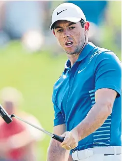  ??  ?? Rory Mcilroy wills an eagle putt to drop on the 12th green.