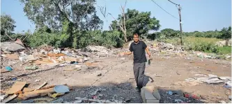 ?? | ZANELE ZULU African News Agency (ANA) ?? ROBIN Naidoo, chairperso­n of the Indian Land Claimants Associatio­n, on stolen land next to Malacca informal settlement which is now being used for illegal dumping.