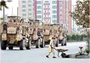  ?? PIC/AP-PTI ?? Military vehicles maintain a vigil after an attack on the American University of Afghanista­n in Kabul on Thursday