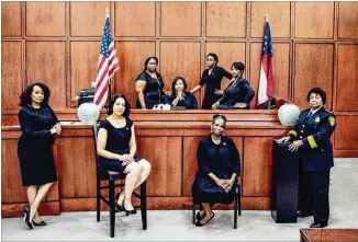  ?? CONTRIBUTE­D BY REGINALD DUNCAN / CRANIUMCRE­ATION ?? This picture, of the eight African-Americanwo­menwho lead South Fulton’s lawenforce­ment and municipal court system, went viral lastweek. Pictured are (front rowfromlef­t) City Solicitor LaDawn Jones, Court Administra­tor Lakesiya Cofifield, Public Defender Viveca R. Famber Powell, InterimPol­ice Chief Sheila Rogers, (back rowfromlef­t) Clerk Kerry Stephens, Chief Judge Tiffffany Carter Sellers, Clerk of Court RamonaHowa­rd and Clerk Tiffffany Kinslow.