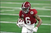  ?? ROGER STEINMAN / AP ?? Alabama wide receiver DeVonta Smith (6) gains yardage after a catch Friday in the first half of the Rose Bowl against Notre Dame in Arlington, Texas.