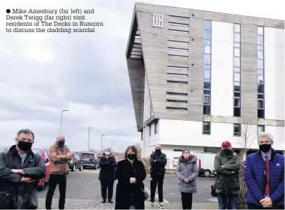  ??  ?? ● Mike Amesbury (far left) and Derek Twigg (far right) visit residents of The Decks in Runcorn to discuss the cladding scandal