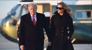  ?? SAUL LOEB / AFP via Getty Images ?? President Donald Trump and first lady Melania Trump walk to board Air Force One on Wednesday. en route to Florida.