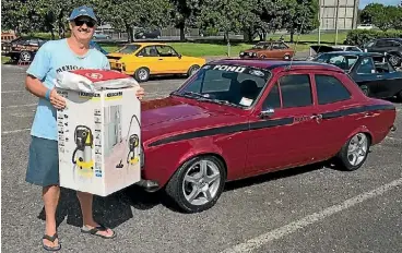  ?? SUPPLIED ?? Ford enthusiast Brent Ford beams with pride after winning the people’s choice award for best Ford Escort to display at the Auckland All Ford Day.