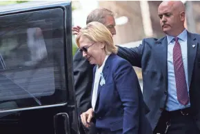  ?? GETTY IMAGES ?? Democratic presidenti­al nominee Hillary Clinton gets in her car Sunday while leaving her daughter’s apartment after departing from a 9/11 ceremony after feeling “overheated.”