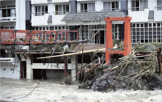  ?? The Yomiuri Shimbun ?? The remains of a bridge in front of a hotel in Hita, Oita Prefecture, are seen on July 7.