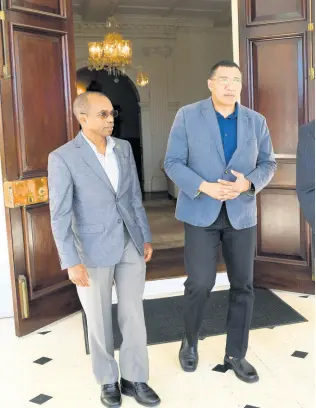  ?? FILE ?? Lieutenant General Rocky Meade (left), with Prime Minister Andrew Holness at Vale Royal on January 1, 2019.