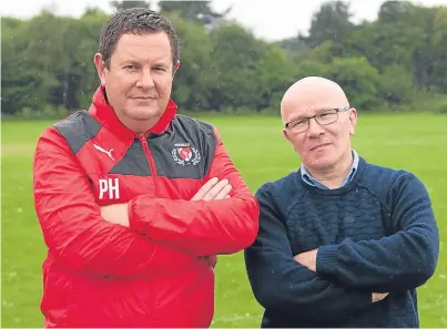  ?? Picture: Paul Smith. ?? Phil Hope, chairman of Carnoustie Panmure Community Club, and Councillor David Cheape are both annoyed at the amount of dog fouling on the club’s pitch.