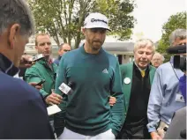  ?? Brant Sanderlin / Atlanta Journal-Constituti­on ?? U.S. Open champion Dustin Johnson withdrew from the Masters shortly before his first-round tee time April 6.