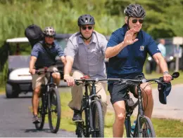  ?? ANDREW HARNIK/AP ?? President Biden goes on a bike ride July 10 in Gordons Pond State Park in Rehoboth Beach, Del. As Biden turns 80, no decision has been made on a reelection bid in 2024.