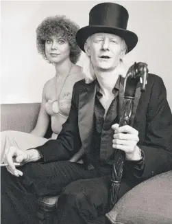  ?? | ERIC GAILLARD/AFP/GETTY IMAGES ?? Johnny Winter and his girlfriend in Nice, France, in 1979. Rolling Stone magazine named him as one of the top 100 guitarists of all time.