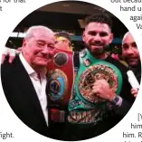  ??  ?? FIRST TARGET: Arum and Ramirez pose with the belts Taylor wants