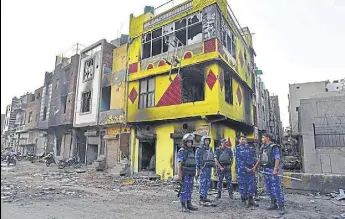  ?? SANCHIT KHANNA/HT ?? Security personnel in riot-hit north-east Delhi.