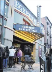  ?? Danny Moloshok The Associated Press ?? A K-9 police unit walks in front of the Egyptian Theatre at the Sundance Film Festival premiere of “Leaving Neverland” on Friday in Park City, Utah.