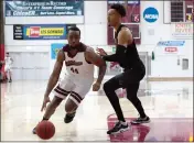  ??  ?? Kelvin Wright Jr. (44) of Chico State looks for room to get around Cal State Dominguez Hills center Andrew Whitsett in the first half Thursday night at Acker Gym.