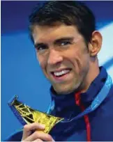 ??  ?? GOLD COAST: A file photo taken on August 24, 2017 shows Michael Phelps of the US reacting during the medal ceremony following the men’s 100m butterfly final at the Gold Coast Aquatic Centre in Gold Coast. — AFP