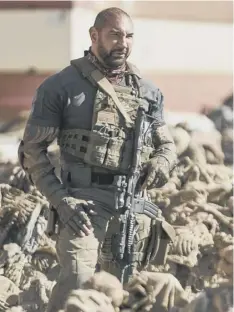  ??  ?? 0 Dave Bautista as Scott Ward in Army Of The Dead
