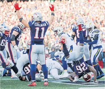  ?? USA TODAY SPORTS ?? The Patriots’ Sony Michel, No.26, scores a touchdown against the Chargers at Foxborough on Sunday.